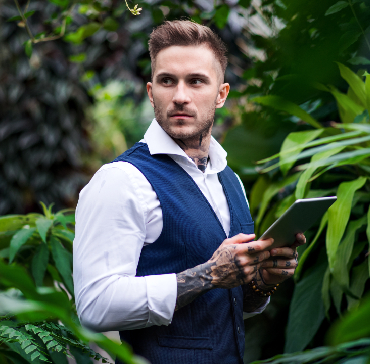 httpselements.envato.comyoung man with tablet standing in botanical garden 966pv2y